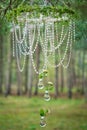 Wedding decor with wheel, glass beads and roses in bulbs