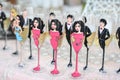 Wedding decor, wine glasses and champagne flutes on table. Champagne flutes painted as women and men. Festive wedding glasses