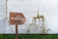 Wedding decor. Wooden plaque with the inscription in paint Wedding. Wood hand made signboard, welcome wedding decoration Royalty Free Stock Photo