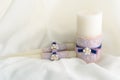 Wedding decorated candles with the bowknot and pearls in blue and violet colors