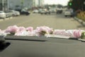 Wedding decoration by car. Floral fabric ribbon on the car Royalty Free Stock Photo