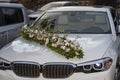 Wedding decoration of a car from a flower arrangement, on the hood of a car Royalty Free Stock Photo