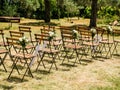 Wedding decoration chairs in rustic green style. Wedding ceremony outdoors Royalty Free Stock Photo