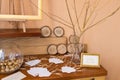 Wedding decoration. Golden walnut in a glass round vase. The wish tree