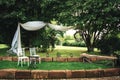 Wedding decoration prepared for ceremony in garden or park.Two white chairs on lawn in park. Outdoor nuptials. Wedding Royalty Free Stock Photo