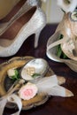 Wedding decoration: shoes, rings and bouquet on a table Royalty Free Stock Photo