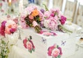 Wedding decoration on table. Floral arrangements and decoration. Arrangement of pink and white flowers in restaurant for event Royalty Free Stock Photo