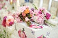 Wedding decoration on table. Floral arrangements and decoration. Arrangement of pink and white flowers in restaurant for event Royalty Free Stock Photo