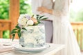 Wedding decoration table in the garden, floral arrangement, In the style vintage on outdoor. Wedding cake with flowers. Decorated Royalty Free Stock Photo