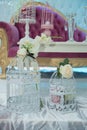 Wedding decoration. Two old ornamental cages decorated with colorful flowers. Two white decorative bird cages filled with flowers