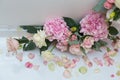 Wedding decorations. Holiday decoration vase with fresh flowers near the wedding arch. Pink roses and carnations Royalty Free Stock Photo