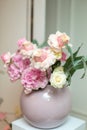 Wedding decorations. Holiday decoration vase with fresh flowers. Pink roses and carnations Royalty Free Stock Photo