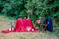 Wedding decorations outdoors. Glasses of wine, plate with fruits and floral decorations on the table. Royalty Free Stock Photo