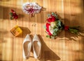 Wedding detail. Accessories for the bride. Shoes, rings, earrings,bracelet and boutonniere Royalty Free Stock Photo