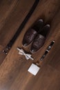 Wedding details. Groom accessories. Shoes, rings, belt, and bowtie