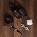 Wedding details. Groom accessories. Shoes, rings, belt, and bowtie Royalty Free Stock Photo