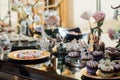 Wedding. Wedding details. Mr and Mrs. Delicious wedding reception candy bar table. Sweet holiday buffet with cupcakes Royalty Free Stock Photo