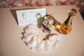 Wedding details. Perfume, garter and wedding invitation Royalty Free Stock Photo