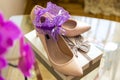 Wedding details. Purple Garter on Bride`s Slippers. Box with a gift