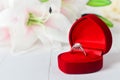 Wedding diamond ring at red velvet jewelry box