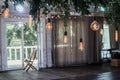 Wedding dinner interior with Industrial hanging lamps in the nature in a wedding decor Royalty Free Stock Photo