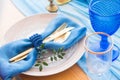 Wedding dinner table detail in white, gold and blue color. Selective focus. Royalty Free Stock Photo