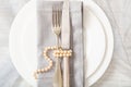 Wedding table place setting with plates, fork and knife, top view Royalty Free Stock Photo