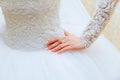 Wedding dress and bride's hands ring