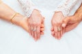 Wedding dress and bride's hands ring