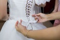 Wedding dress of the bride to tie a corset Royalty Free Stock Photo