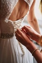 Wedding dress close-up hands knotted corset bride Royalty Free Stock Photo