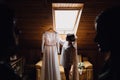 Wedding dress embroidered with crystals and pearls hangs over th Royalty Free Stock Photo