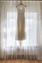 Wedding dress on hanger, morning of bride Royalty Free Stock Photo