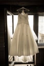 Wedding dress hanging above door