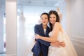 LGBT couple asian embracing each other after the bride tries on the wedding dress Royalty Free Stock Photo