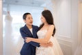 LGBT couple asian embracing each other after the bride tries on the wedding dress Royalty Free Stock Photo