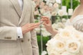 Wedding engagement rings. A married couple exchanges wedding rings at a wedding ceremony. The bride puts a ring on Royalty Free Stock Photo