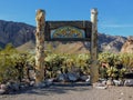 Wedding and Event Background wooden poles and decoration with Cholla Jumping Cactus and mountains in background