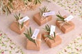 Wedding favors brown craft guest gifts box handmade soap with olive leaves decoration Royalty Free Stock Photo