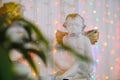 Wedding figurine angel against the bright lights