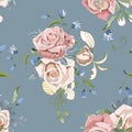 Wedding floral bouquets of peach cream roses and bluebells on grey blue background.