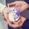 Wedding floral lock in hands bride and groom