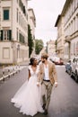 Wedding in Florence, Italy. Multiethnic wedding couple. African-American bride in a white dress and Caucasian groom in a