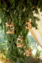 Wedding floristry.Eco style.Branches ate with golden cages and flowers. Arch of branches.