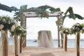 Wedding flower arch, post and decoration on beach Royalty Free Stock Photo