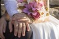 Wedding flowers bouquette in hands bride and groom