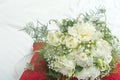 Wedding flowers Bridal bouquet of white flowers tied with a ribbon