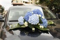 Wedding flowers on a expensive car Royalty Free Stock Photo