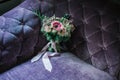 Wedding flowers on the puprle velvet soffa