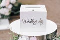 Wedding gift box for money with the inscription wedding day in white on stand Royalty Free Stock Photo